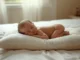 Mustard seed pillow for baby placed under a newborn's head during supervised rest