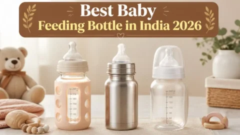 Glass, stainless steel, and BPA-free plastic baby feeding bottles placed side by side on a white surface — comparison of best baby feeding bottle options in India