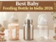 Glass, stainless steel, and BPA-free plastic baby feeding bottles placed side by side on a white surface — comparison of best baby feeding bottle options in India